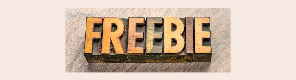 Freebie spelled with wooden letter blocks