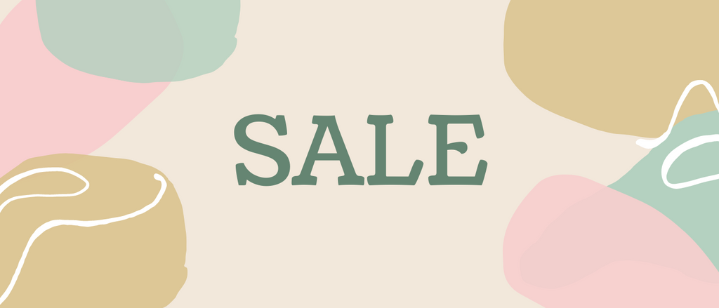 the word sale is in capital letters in a dark green colour on a cream background with pink, green and mustard splodges